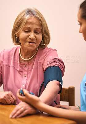 Buy stock photo Heart rate, nurse and senior woman in house for healthcare test at cardiovascular consultation. Hypertension, medical and caregiver check pulse of elderly patient with blood pressure machine in home.