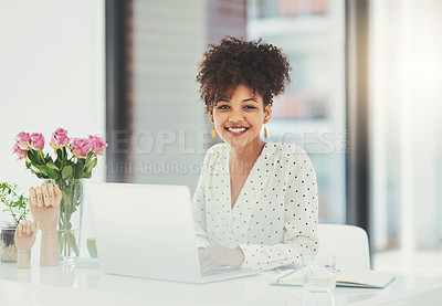 Buy stock photo Shot of a beautiful young businesswoman sitting behind her laptop