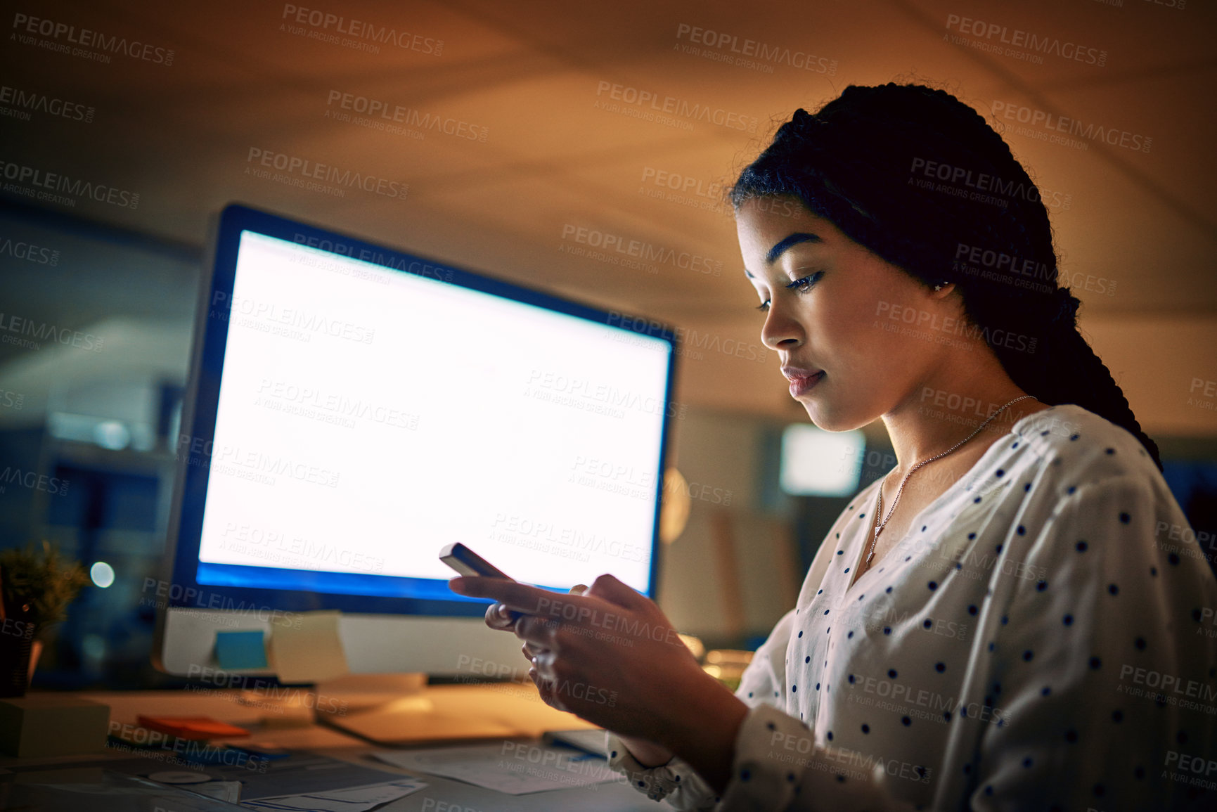 Buy stock photo Shot of a young businesswoman using a digital tablet during a late night at work