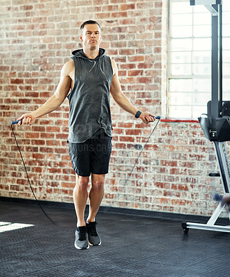 Buy stock photo Shot of a man working out in a gym