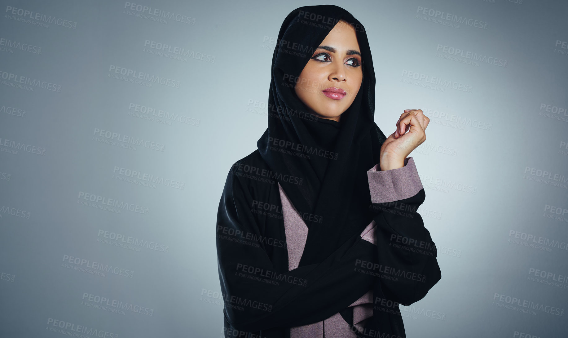 Buy stock photo Studio shot of a young muslim businesswoman against a grey background