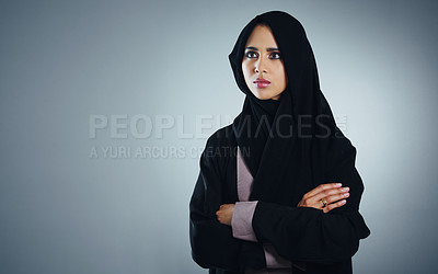 Buy stock photo Studio shot of a young muslim businesswoman against a grey background