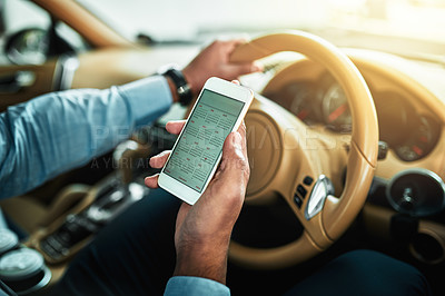 Buy stock photo Closeup shot of an unrecognisable businessman using a cellphone while driving