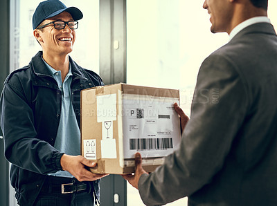 Buy stock photo Shot of a courier making a delivery to a customer