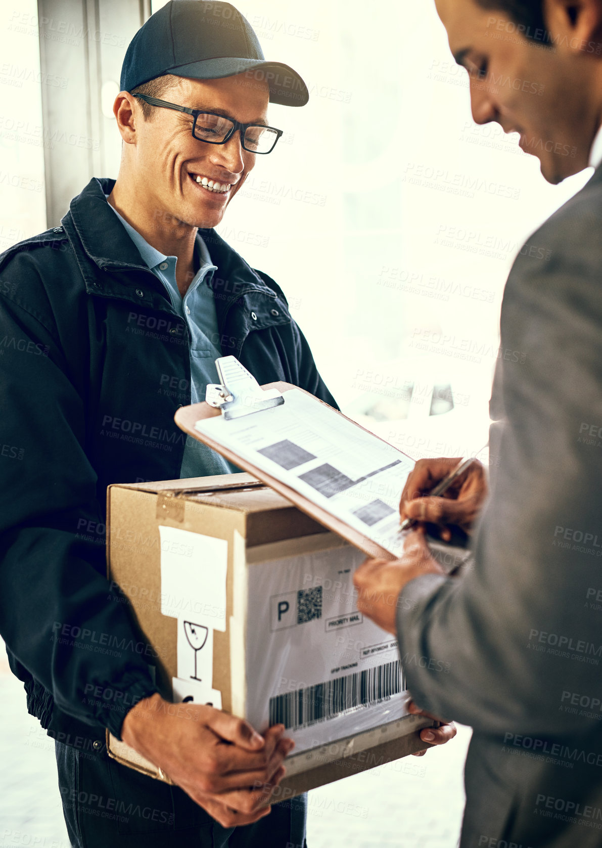 Buy stock photo Delivery man, sign and package with customer for paperwork, stock or inventory for shipping at front door. People, documentation and courier for invoice with writing, cargo and transport for service