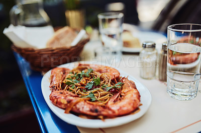 Buy stock photo Cropped shot of a delicious prawn dish being served at a restaurant