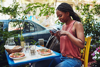Buy stock photo Cropped shot of a woman taking a picture of her food