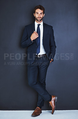 Buy stock photo Portrait, fashion and a formal business man in studio on a blue background for contemporary corporate style. Success, professional and a confident young male employee in a suit for executive power