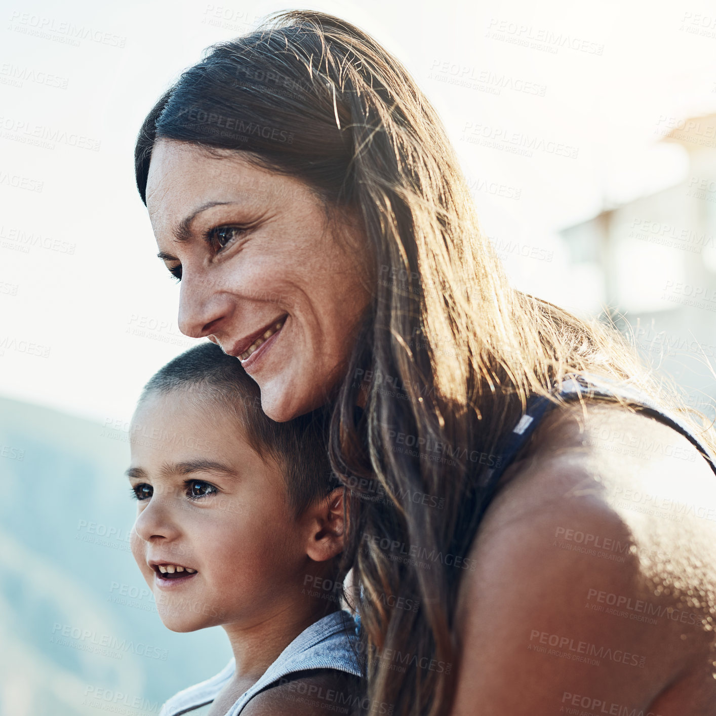 Buy stock photo Happy, hug and mother with child for bonding, connection and family time together outdoor. Smile, relax and mom holding and embracing boy kid with care, love and sweet moment in backyard of home.