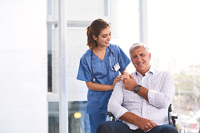 Buy stock photo Portrait of a cheerful young female doctor holding a patient's hand while the patient looks into the camera