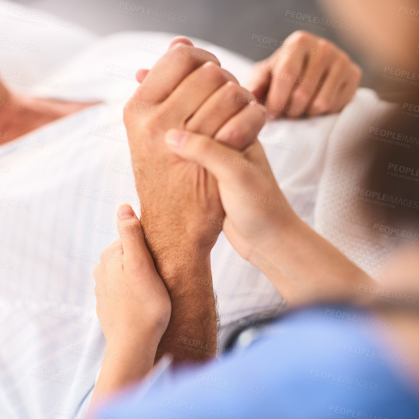 Buy stock photo Closeup of a unrecognisable person's hand being held by a doctor inside a medical clinic