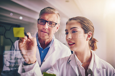 Buy stock photo Scientists, notes and research with ideas, writing and innovation for experiment or collaboration in laboratory. Man, woman and glass wall for planning, pharmaceuticals and science formula for drugs