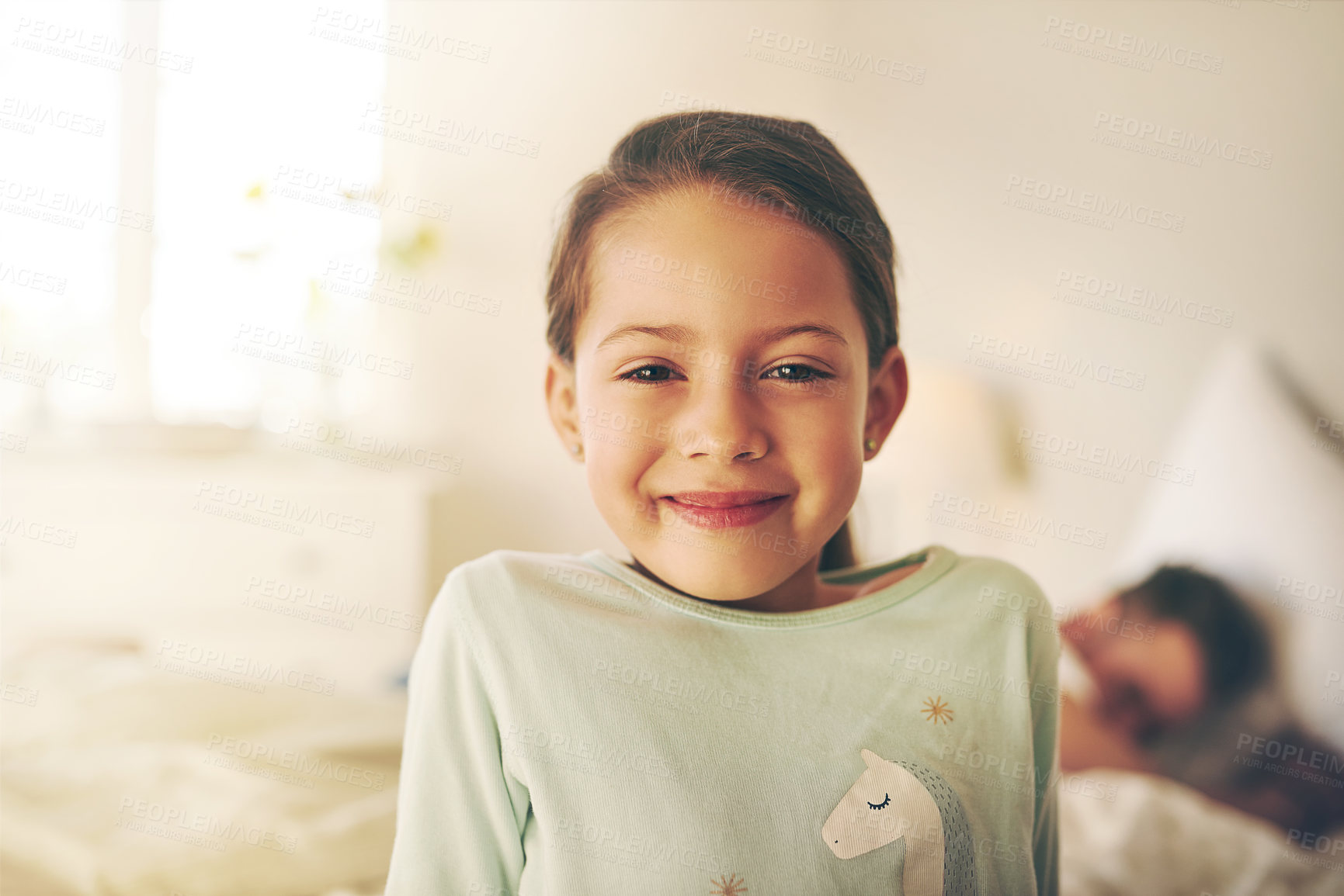Buy stock photo Portrait of a cheerful little girl standing in a bedroom while looking at the camera at home