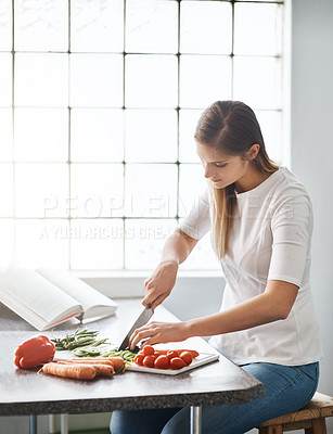 Buy stock photo Woman, kitchen and cutting in vegetables, vegan and healthy meal for cooking, recipe book and instruction. Vegetarian, organic and ingredients with food, diet and wellness or nutrition at home