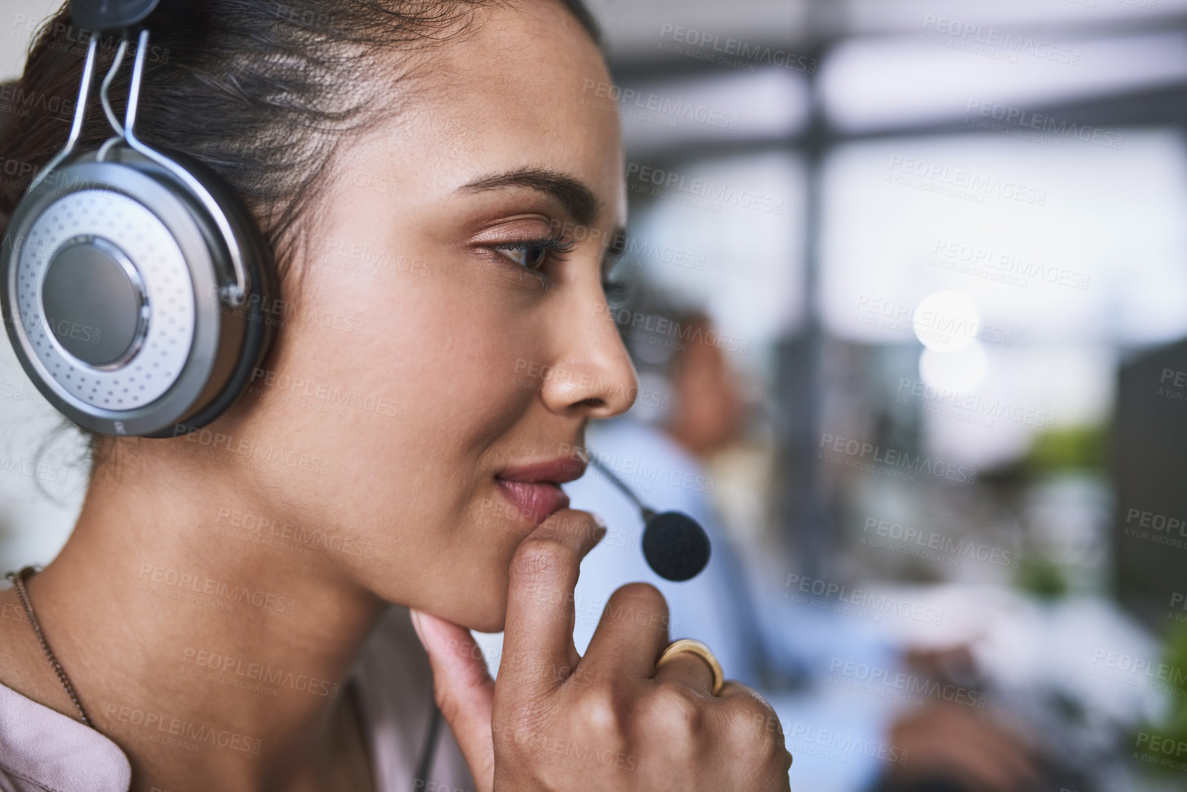 Buy stock photo Shot of a cheerful businesswoman talking to a customer using a headset while contemplating