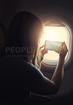 Buy stock photo Shot of a young person in an airplane