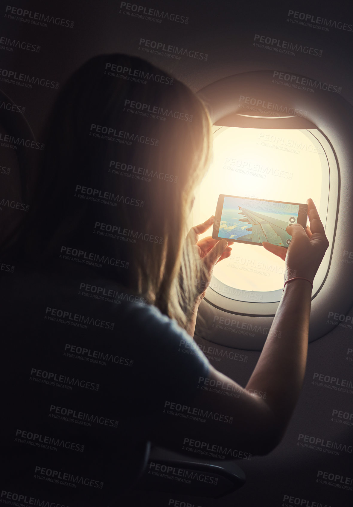 Buy stock photo Airplane, flight and woman by window for picture on international trip, travel or global commute. Transport, photograph and person on aeroplane with view for holiday, vacation and social media memory