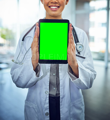 Buy stock photo Portrait of a young female doctor holding a digital tablet with a chroma key screen