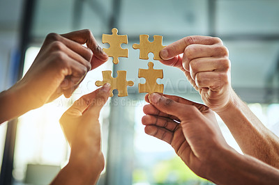 Buy stock photo Group of business people holding puzzle pieces. Professionals connect and collaborate together inside office building. Closeup of hands, and team working together on a new strategy for success