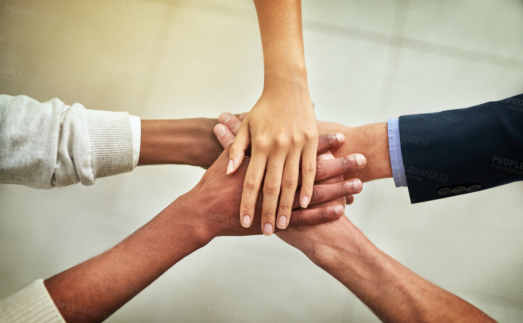 Buy stock photo Cropped shot of a group of businesspeople joining their hands in solidarity