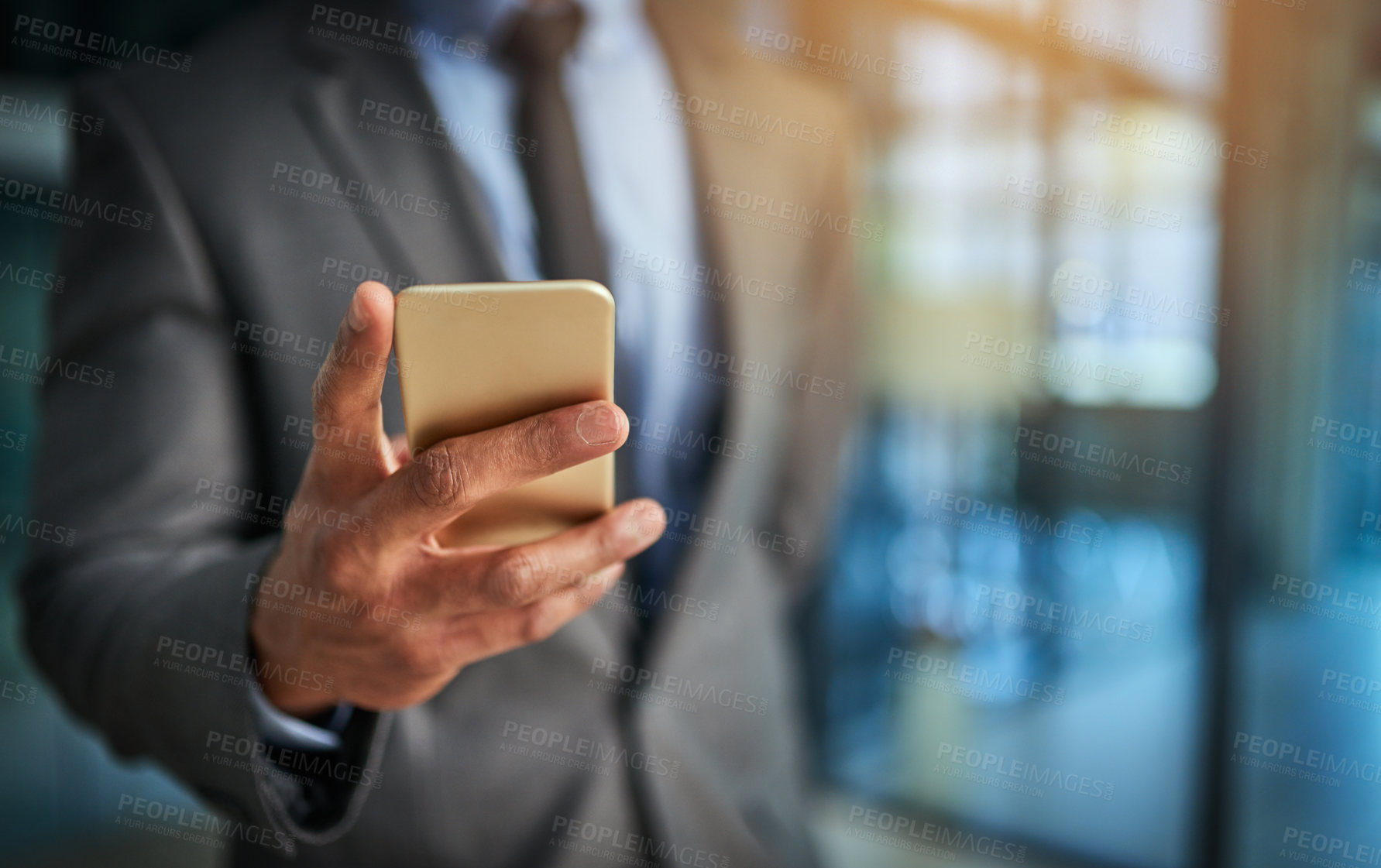 Buy stock photo Executive hand with phone browsing, reading data or texting while working late at night or overtime on office deadline. Closeup of finance analyst monitoring, checking or following stock market trade