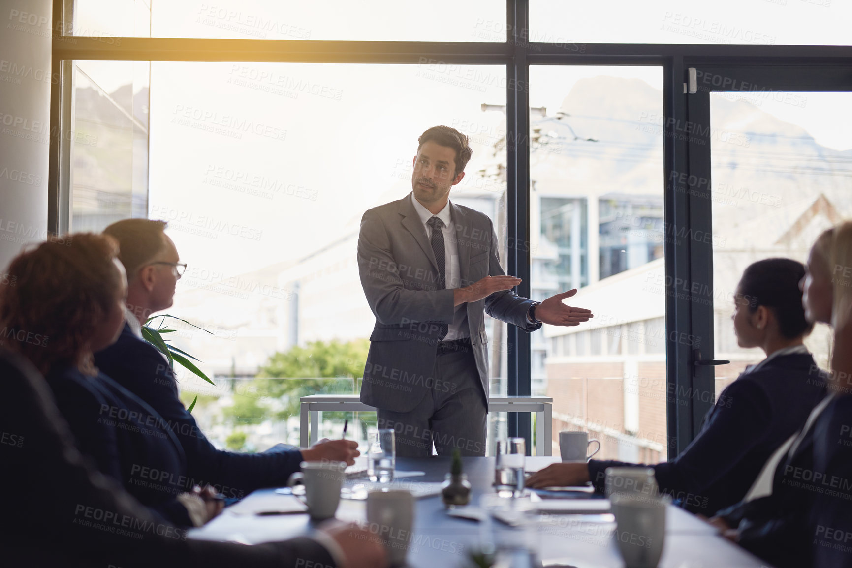 Buy stock photo Shot of a group of businesspeople having a meeting together in a boardroom at the office