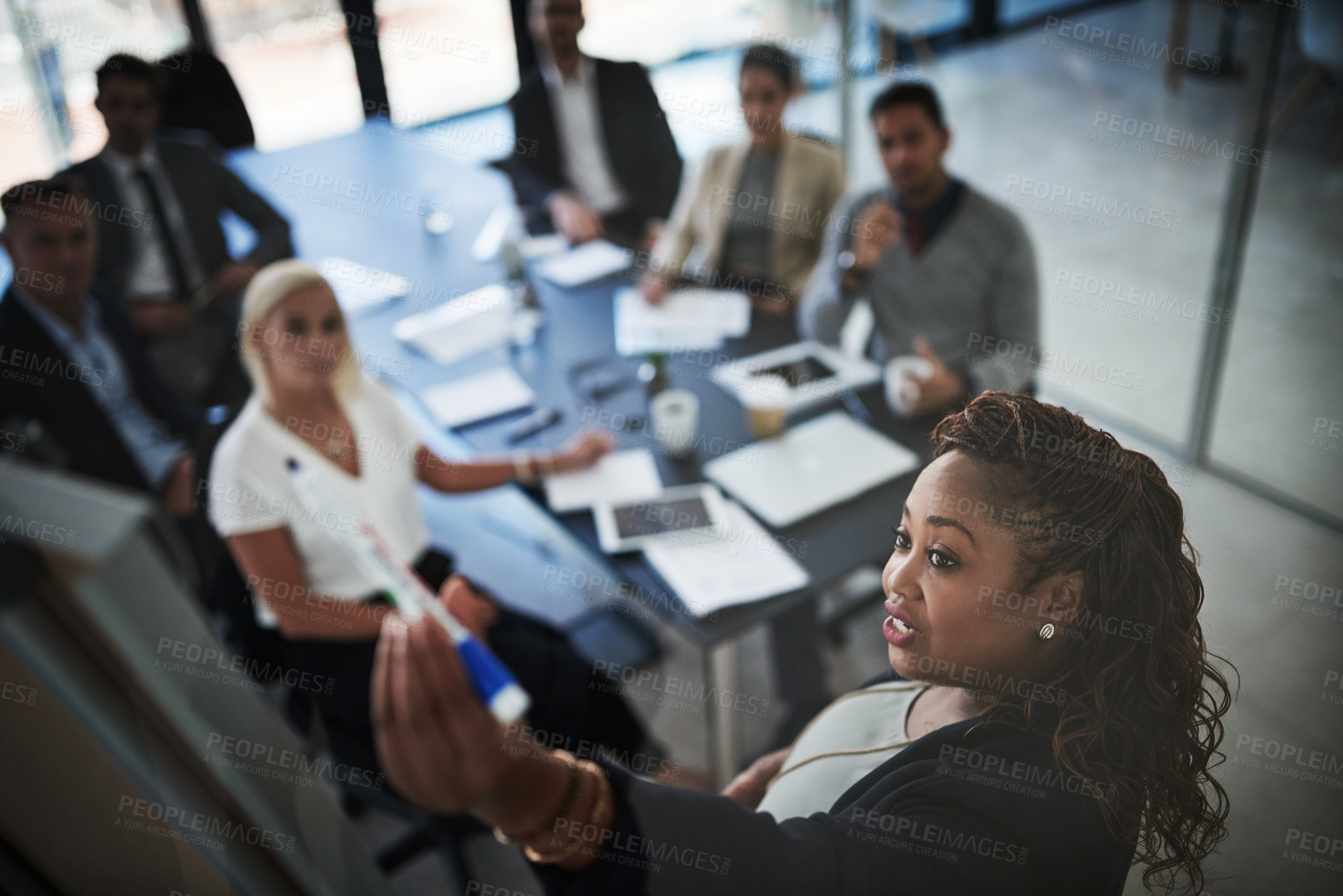 Buy stock photo Business people, presentation and woman with brainstorming, coaching and feedback with report. Group, employees and mentor with information, meeting and planning with speaker, leader and teamwork