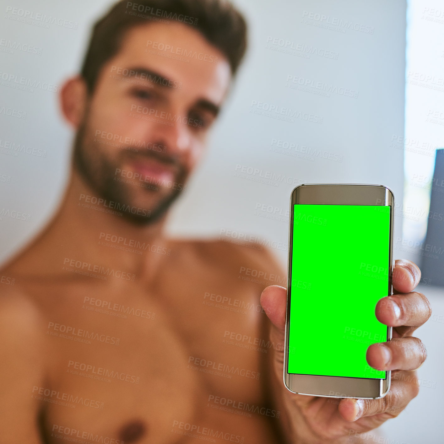 Buy stock photo Hand, man and phone with green screen in home for contact, online dating or ads on app. Closeup, chroma key or mobile display for social media, mockup space or shirtless person show info presentation