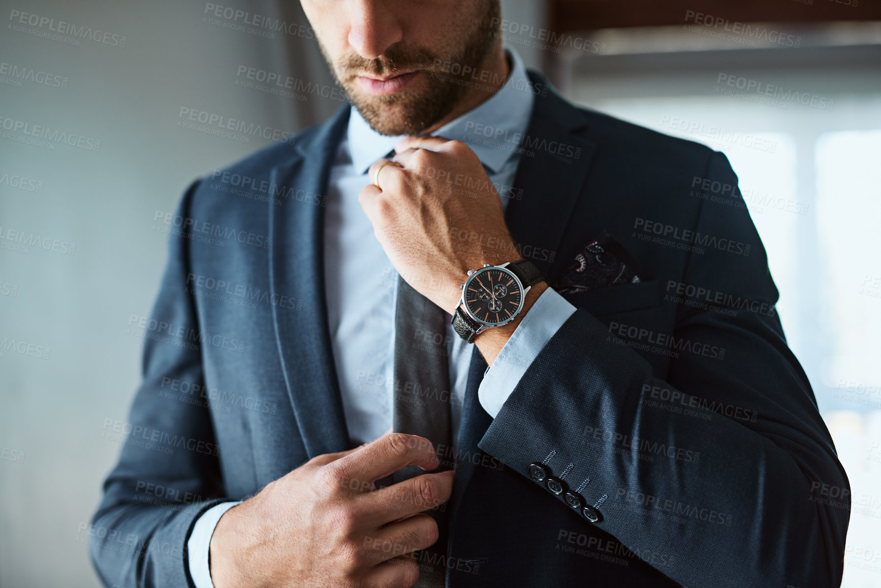 Buy stock photo Shot of an unrecognizable man dressing himself at home