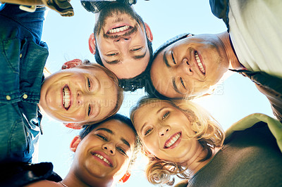 Buy stock photo Shot of a  group of young students enjoying the day outside together