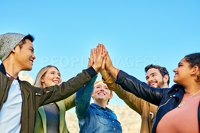 Buy stock photo Shot of a  group of young students enjoying the day outside together