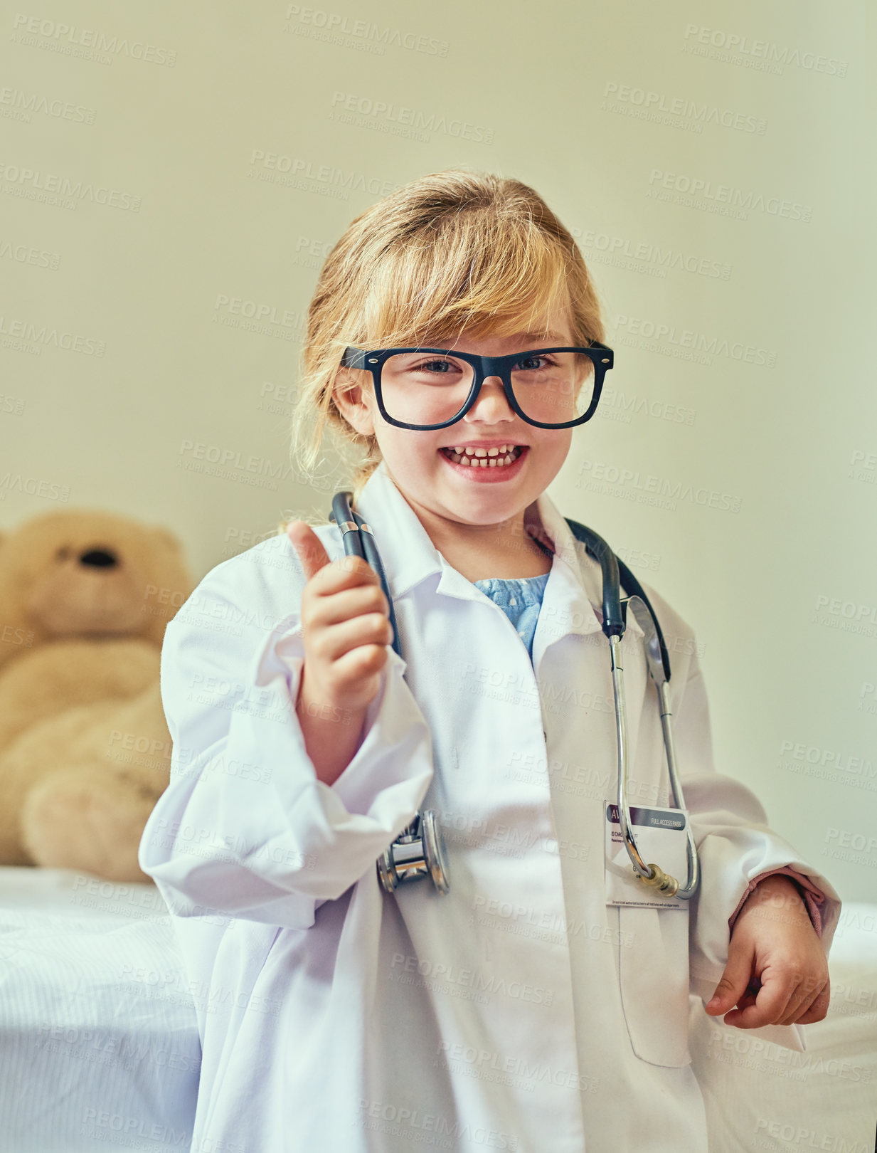 Buy stock photo Doctor, portrait and girl kid with thumbs up for young physician, agreement and future career in home. Healthcare, dress up and child with yes gesture for educational play, development or approval