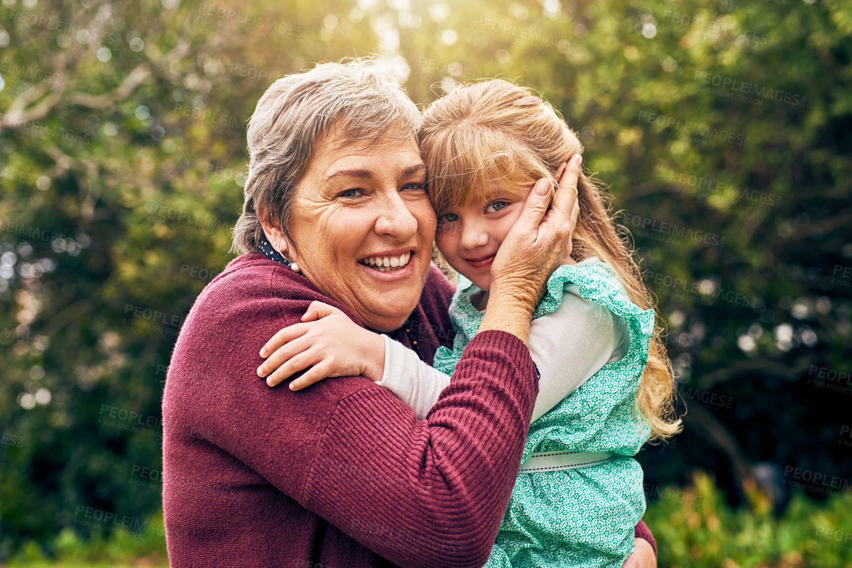 Buy stock photo Grandmother, hug or portrait of kid in nature to relax with smile, support or care together outdoors. Family, happy and senior grandparent in park with girl for bonding, wellness or love in Germany