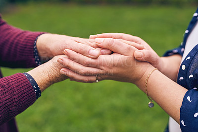 Buy stock photo Closeup shot of unrecognizable women holding hands outside