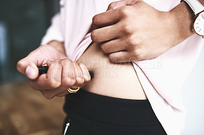 Buy stock photo Closeup shot of an unidentifiable businesswoman injecting her stomach