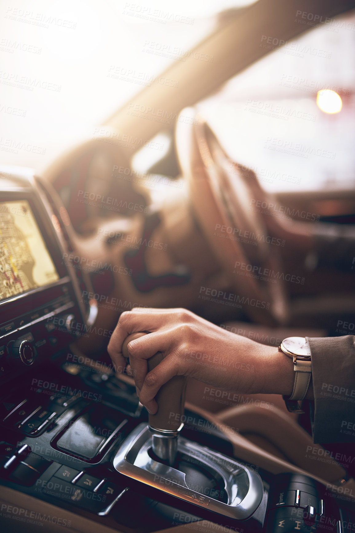 Buy stock photo Shot of an unidentifiable businesswoman changing the gears while driving a car