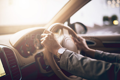 Buy stock photo Shot of an unidentifiable businesswoman driving a car