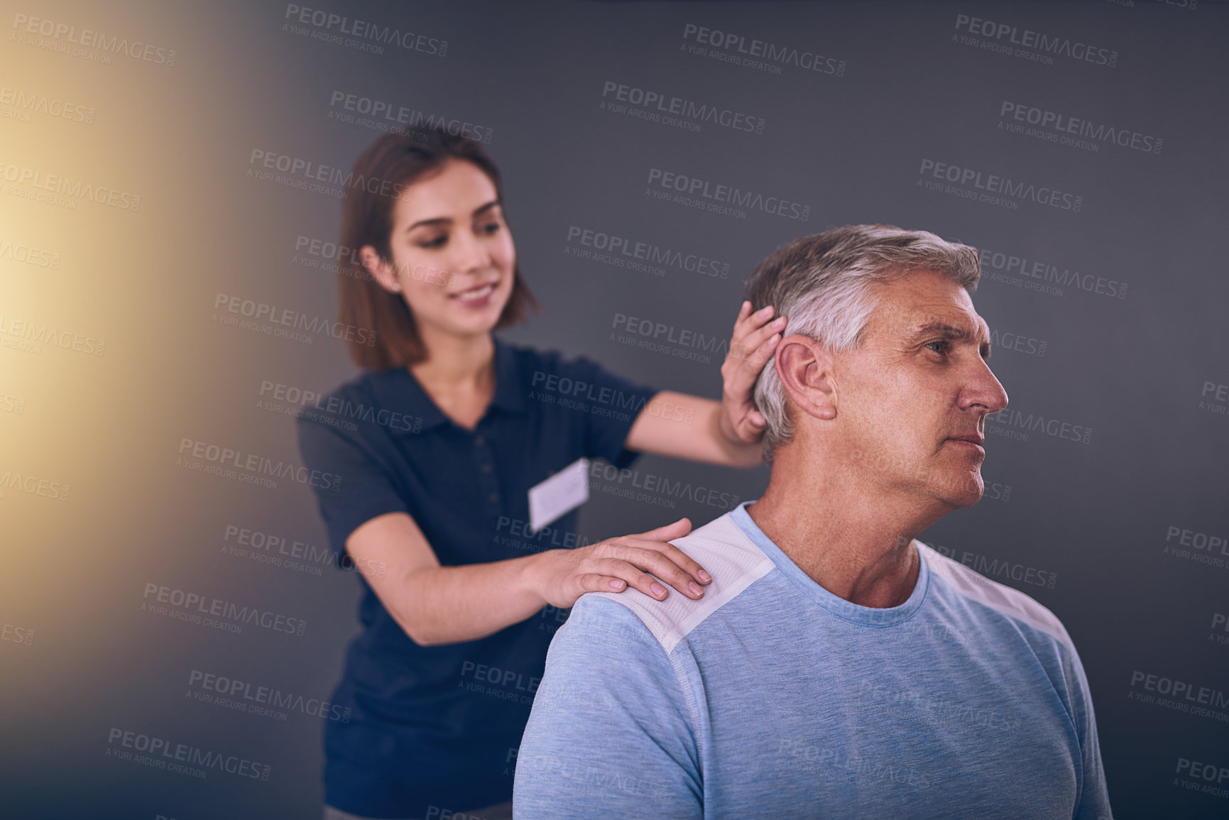 Buy stock photo Physiotherapist, old man and neck for consultation at clinic, rehabilitation and specialist for help. Woman, chiropractor and patient for injury assessment, muscle recovery and support with treatment