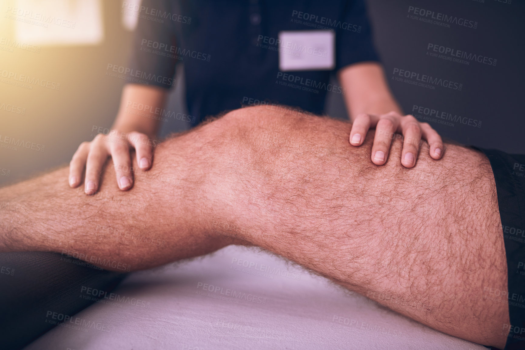 Buy stock photo Hands, leg and physical therapy on bed for consultation, rehabilitation and recovery from pain. Physiotherapist, male patient and knee injury in fitness centre for healthcare, massage and healing