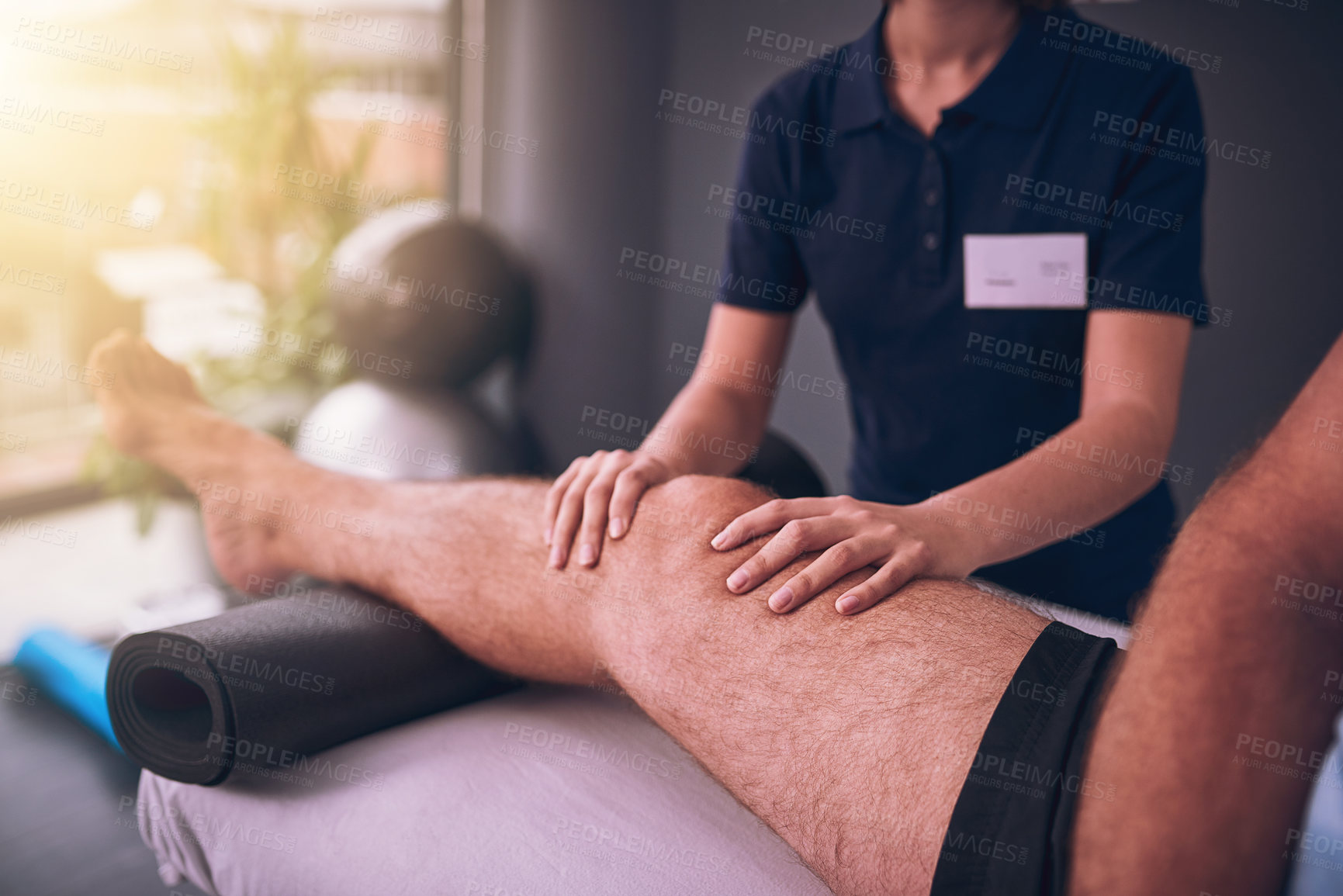 Buy stock photo Physical therapy, hands and leg on bed for consultation, rehabilitation and recovery from injury. Physiotherapist, male patient and knee pain in fitness centre for healthcare, massage and healing