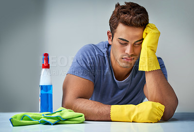 Buy stock photo Tired, cleaning and man with chores, chemical and burnout with hygiene of home, sleeping and done. House, exhausted and person with product for bacteria, routine and spray for sanitation and cloth