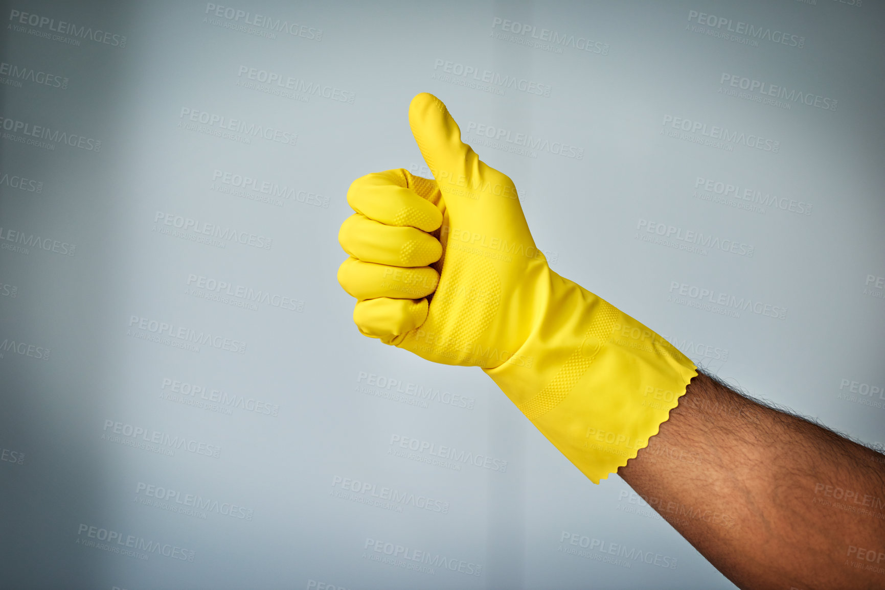 Buy stock photo Glove, thumb up and person in studio, cleaning and finished with chores, promotion and thank you. Mockup space, hand and cleaner for hotel, hygiene and sign for complete job and grey background
