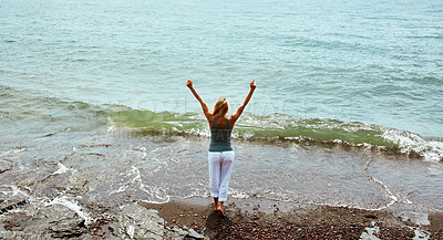 Buy stock photo Back, holiday and woman by ocean for peace, weekend break and tropical destination for abroad getaway. Space, travel adventure and person by beach for vacation, high angle and tourist trip in Morocco