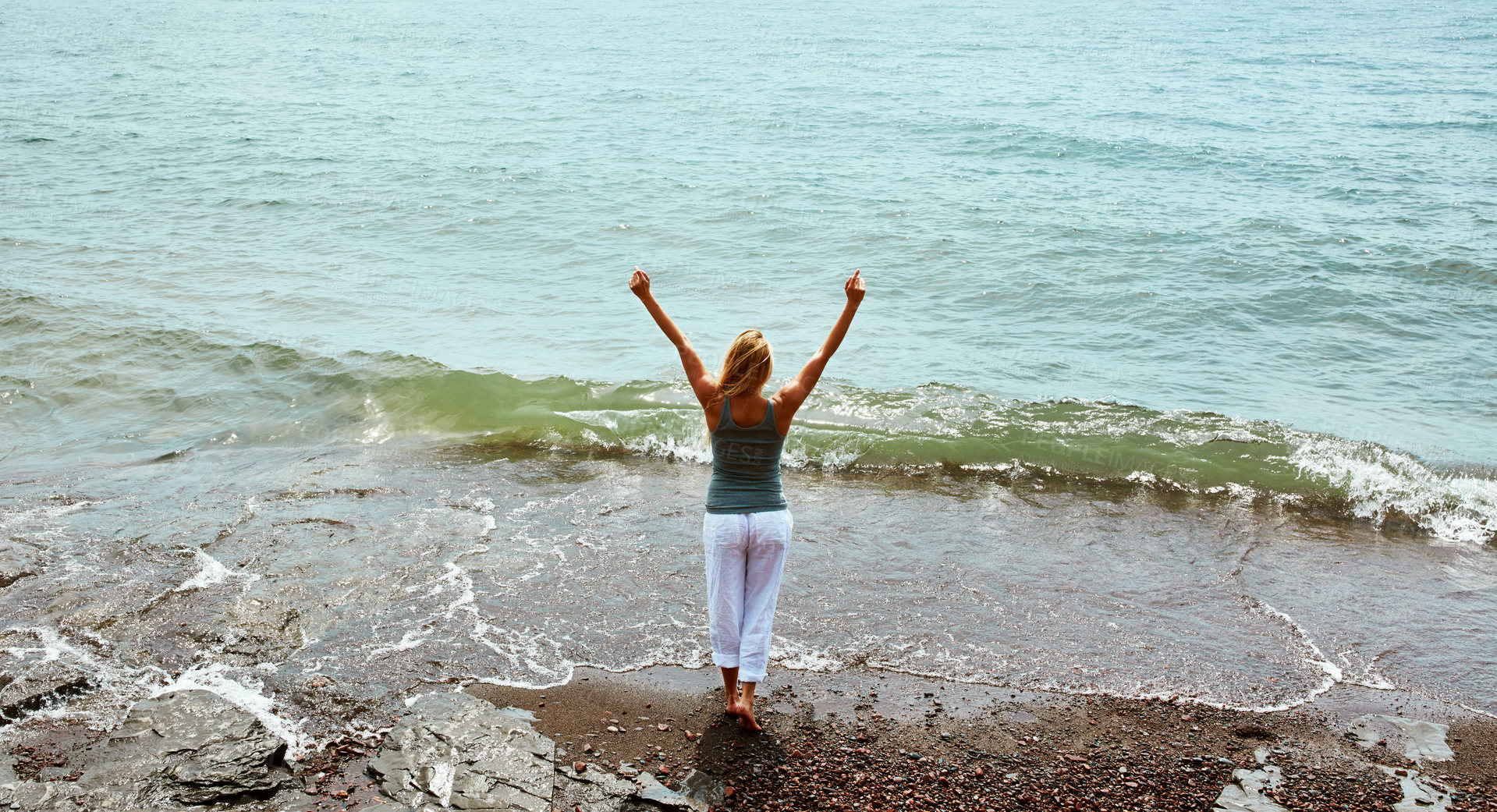 Buy stock photo Back, holiday and woman by ocean for peace, weekend break and tropical destination for abroad getaway. Space, travel adventure and person by beach for vacation, high angle and tourist trip in Morocco