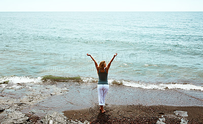 Buy stock photo Back, vacation and woman on beach for peace, weekend break and tropical destination for abroad getaway. Mockup space, travel adventure and person by ocean for holiday, high angle and trip in Morocco