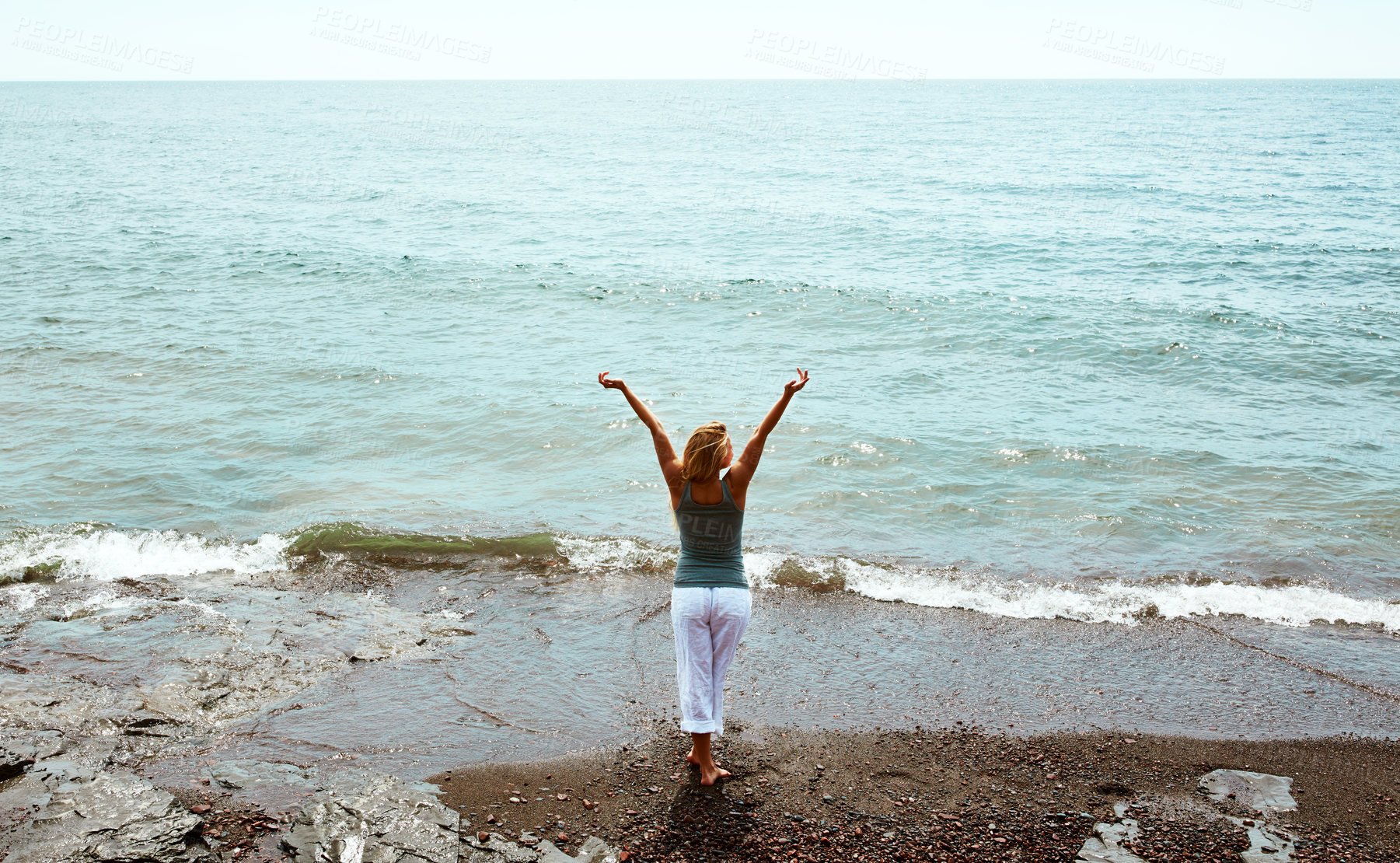 Buy stock photo Back, vacation and woman on beach for peace, weekend break and tropical destination for abroad getaway. Mockup space, travel adventure and person by ocean for holiday, high angle and trip in Morocco