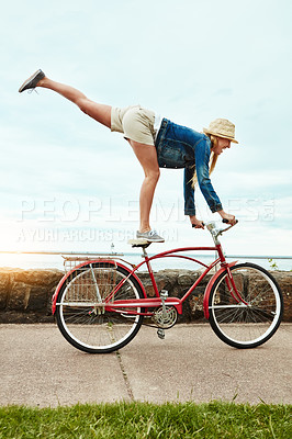 Buy stock photo Vacation, outdoor or woman with bicycle trick, balance development or active hobby for weekend break. Challenge, fun activity or person with stunt execution on sidewalk, skill practice or holiday