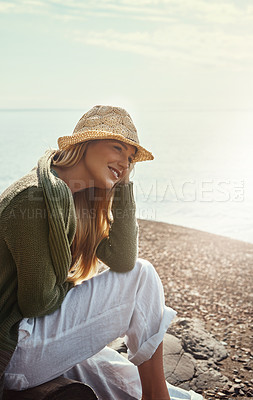 Buy stock photo Shot of a young woman spending a day at the lake