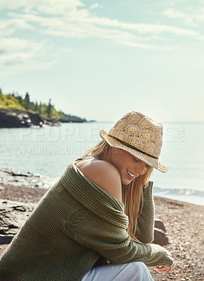 Buy stock photo Woman, happiness and relax at lake for travel, thinking or outdoor adventure in nature with trees. Female person, smile and calm by water for vacation in Canada, wellness and peace in park with hat