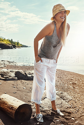 Buy stock photo Shot of a young woman spending a day at the lake